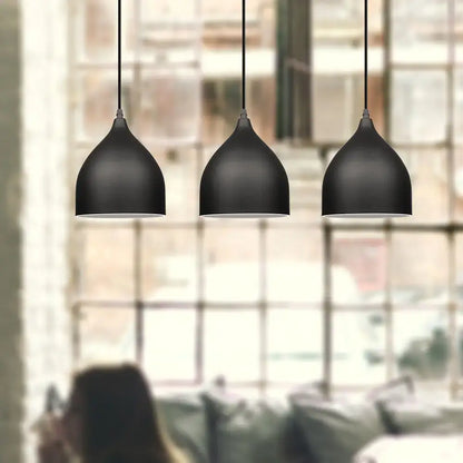 Three sleek black aluminum led pendant lights with matte finish in modern nordic design for kitchen and bedroom use