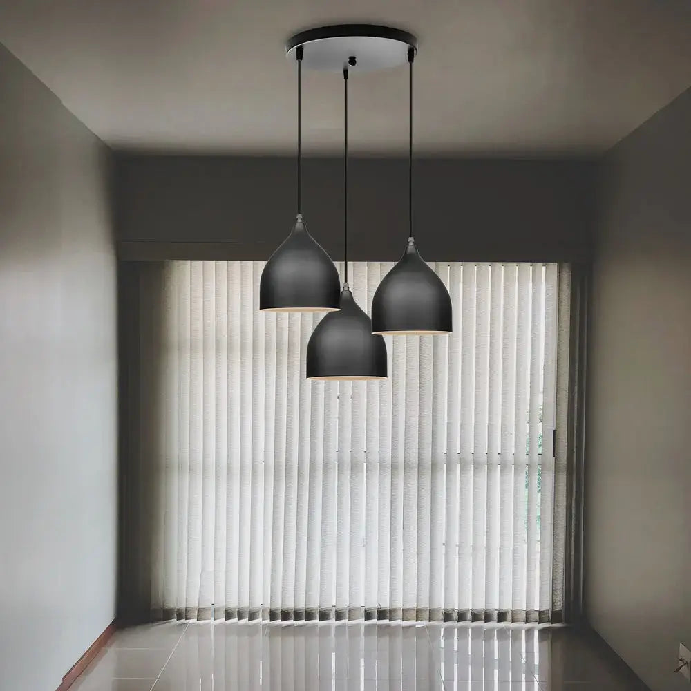 Modern black aluminum led pendant light with sleek teardrop shades hanging from circular ceiling fixture for living room