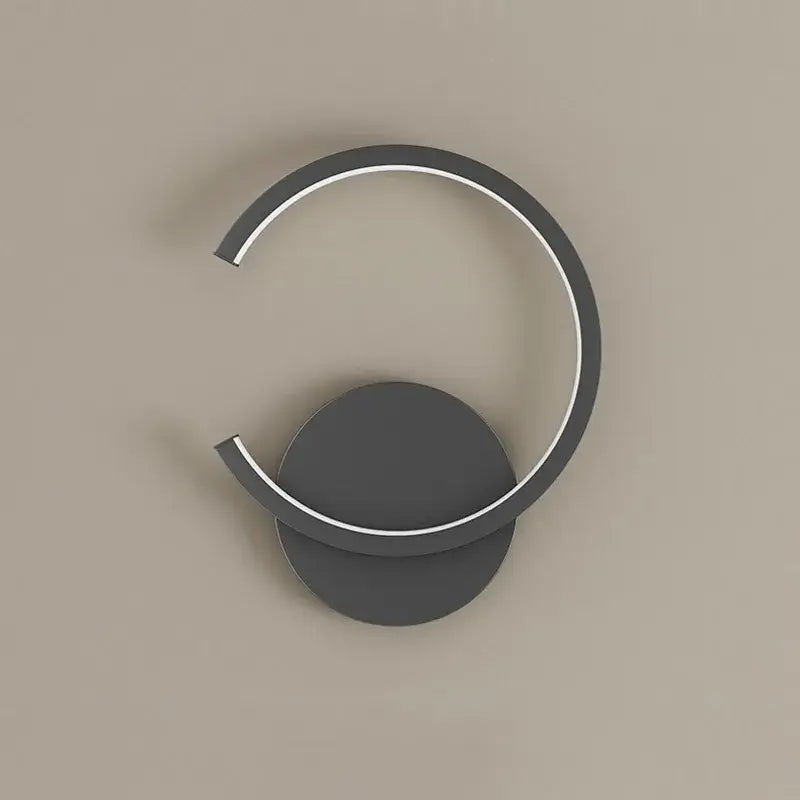 Modern minimalist aluminum led wall lamp with dark gray circular base and illuminated white led ring for home decor