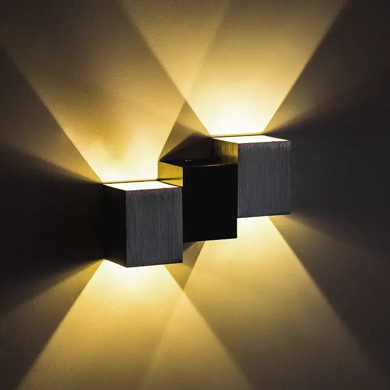 Decorbites™ modern aluminum led wall lamp with brushed metal cubes and black accents casting warm yellow light patterns