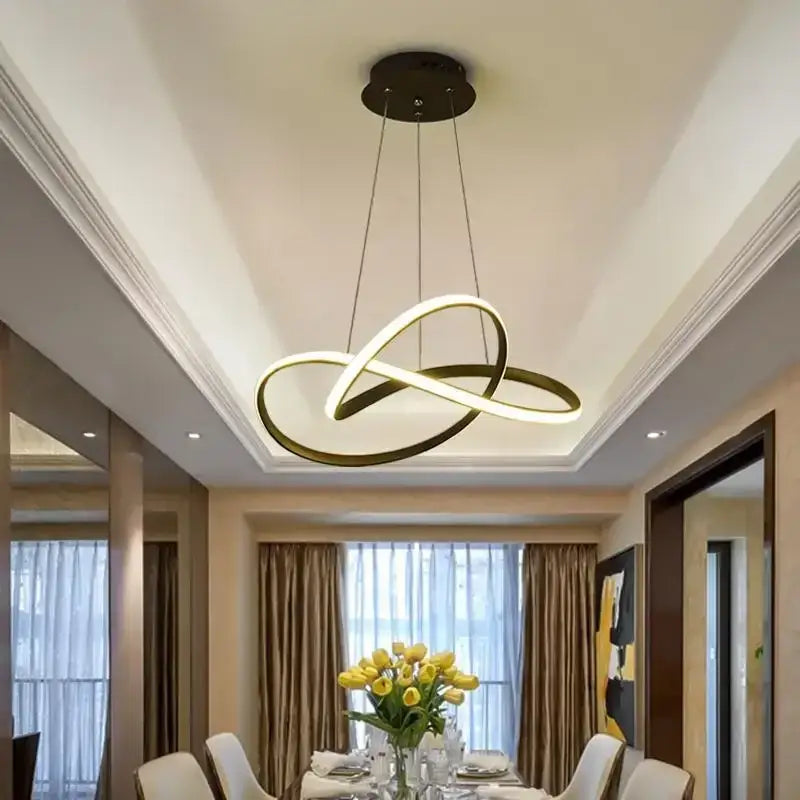 Modern gold-toned aluminum line pendant light with intertwined circular rings for dining room ceiling decor