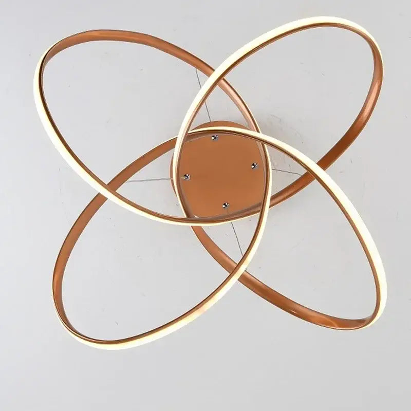DecorBites aluminum line pendant light with modern copper-toned led interlocking rings for creative dining room decor