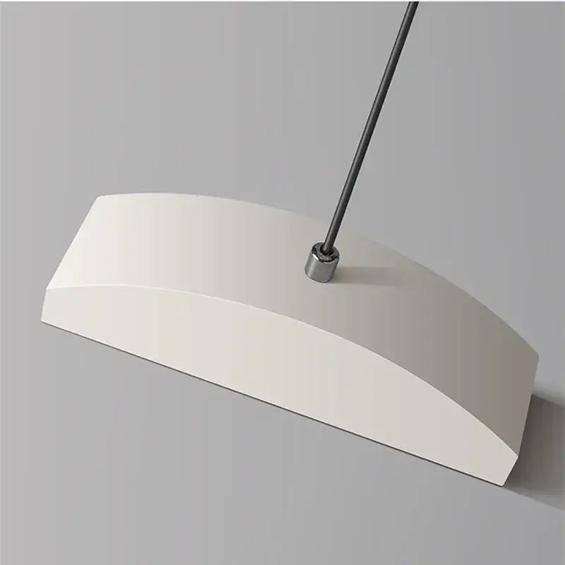 A sleek white decorbites aluminum pendant light chandelier with curved design and metallic suspension rod for dining room