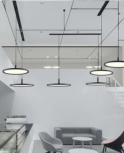 Modern black circular decorbites aluminum pendant light with sleek minimalist design for home and commercial spaces