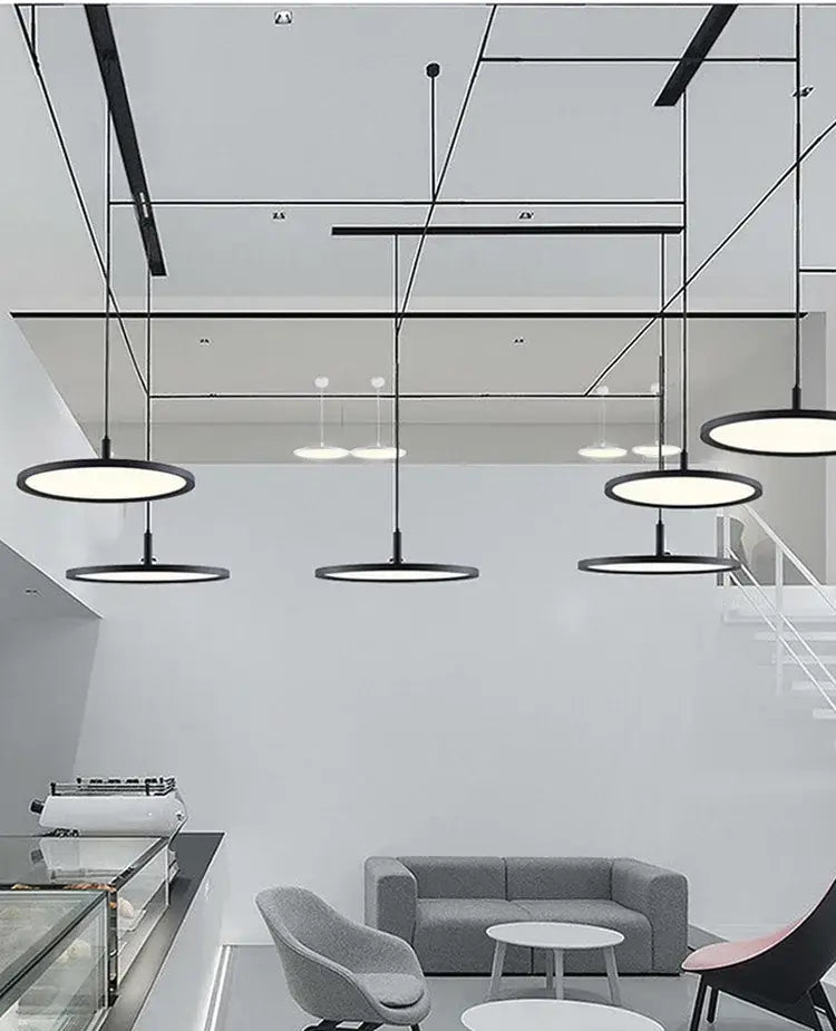 Modern black circular decorbites aluminum pendant light with sleek minimalist design for home and commercial spaces