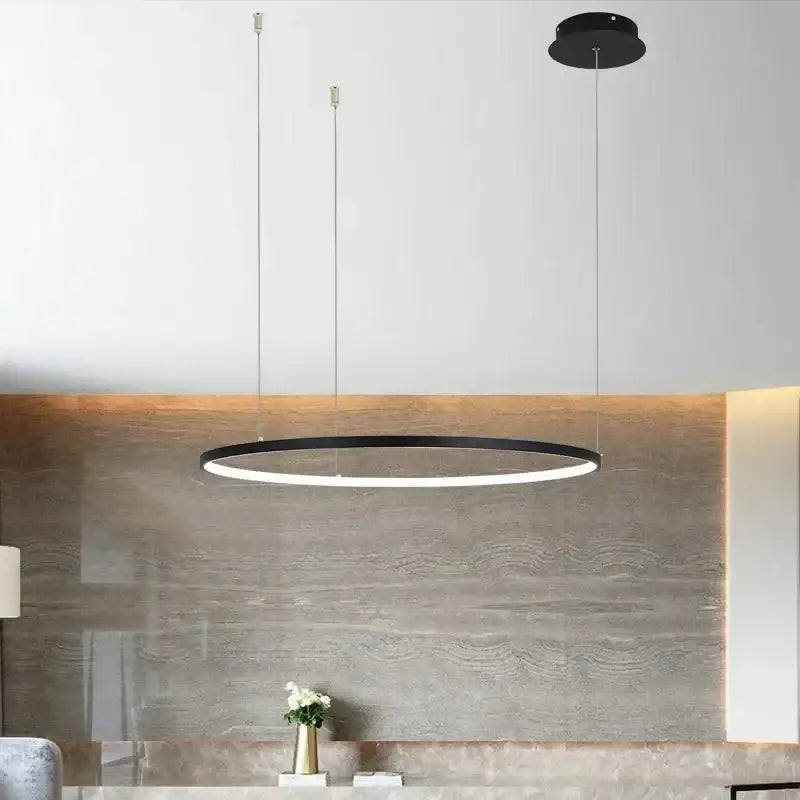Black circular pendant light with aluminum rings led design and thin metallic cords for living and dining rooms