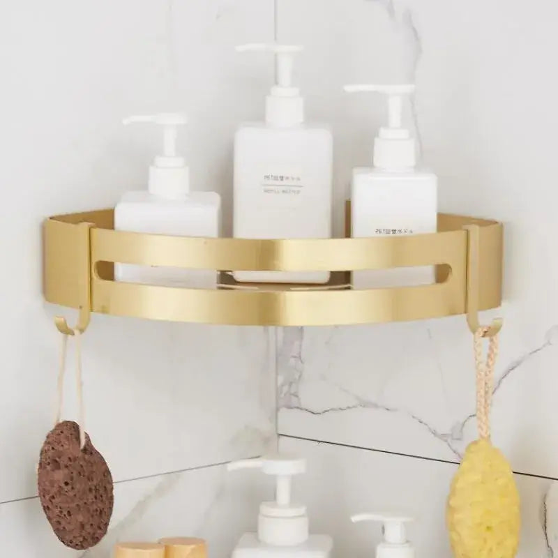 Gold-colored metal decorbites aluminum shower shelf with sleek design and two hooks for bathroom corner use