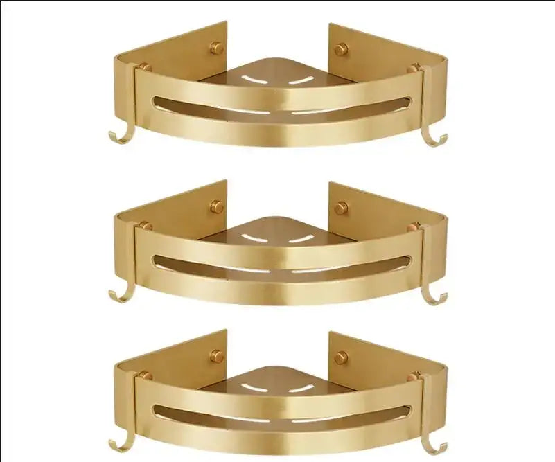 Gold-colored DecorBites aluminum shower shelf with two hooks and central cutout design for bathroom corner use