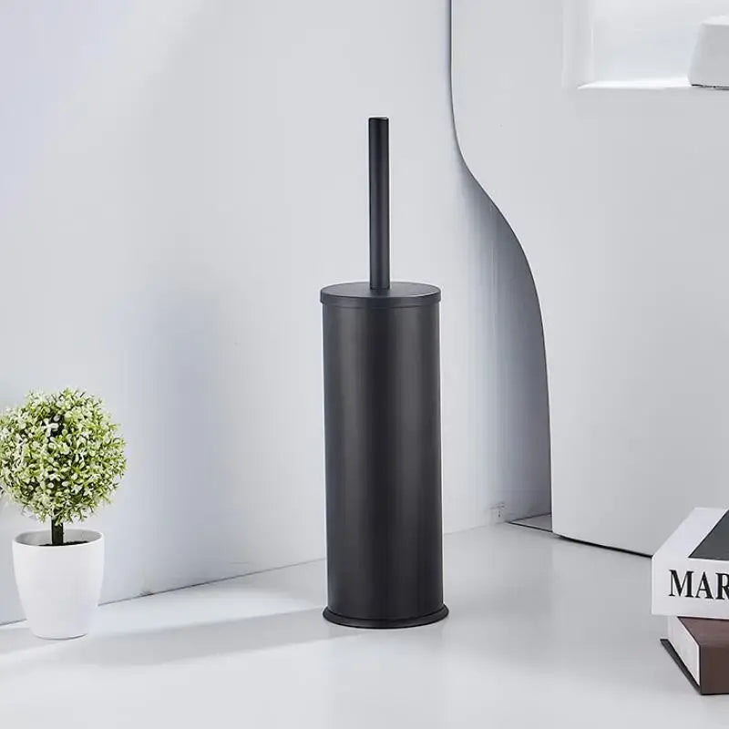 Black matte-finished aluminum toilet brush holder with matching handle from DecorBites™ brush holder set in brushed gold black