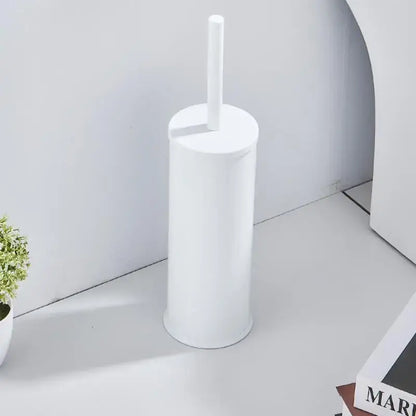 White cylindrical plastic toilet brush holder with matching handle in decorbites aluminum toilet brush holder set