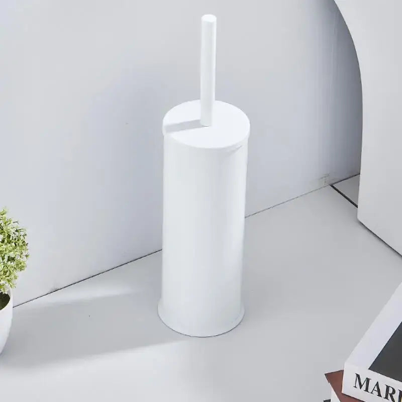 White cylindrical plastic toilet brush holder with matching handle in decorbites aluminum toilet brush holder set