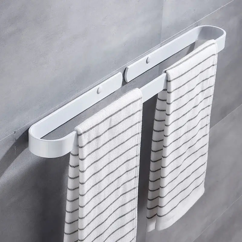 White plastic towel holder with two white towels on decorbites aluminum towel holder matte black wall mounted bar