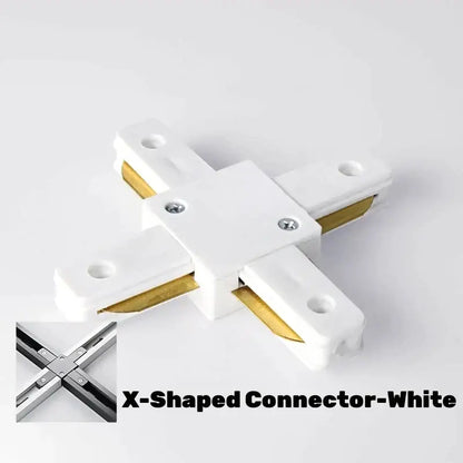 White x-shaped connector with gold metal inserts and silver screws for DecorBites aluminum track rail lighting system