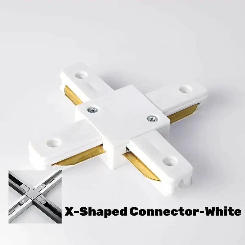 White x-shaped connector with gold metal inserts and silver screws for DecorBites aluminum track rail lighting system