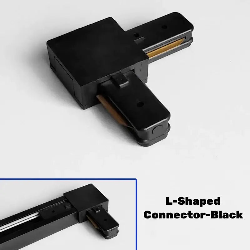 Black l-shaped aluminum track rail connector with matte finish and gold-colored contacts for decorbites track lighting