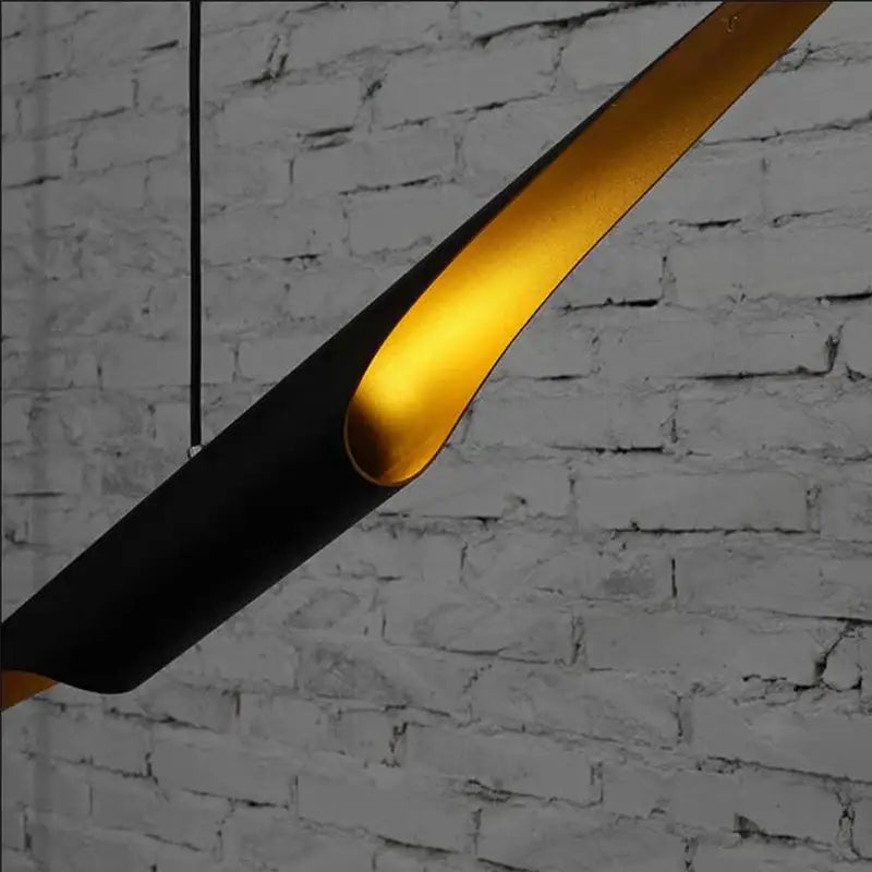 Decorbites aluminum tube chandelier with sleek black and gold aluminum tube pendant emitting warm light for restaurant lighting