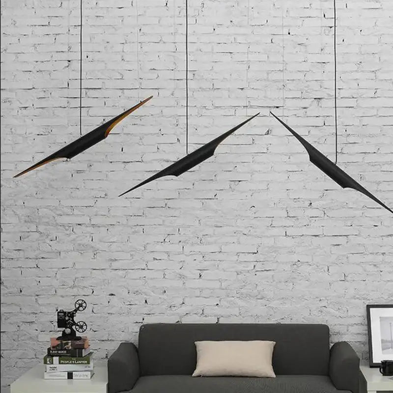 Three sleek black and gold angular decorbites aluminum tube chandelier pendant lights for restaurant and bar lighting