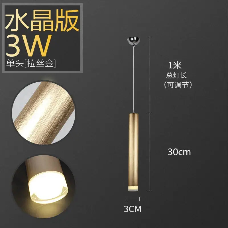 A sleek brushed gold decorbites pendant light with adjustable height aluminum tube for dining room and kitchen decor