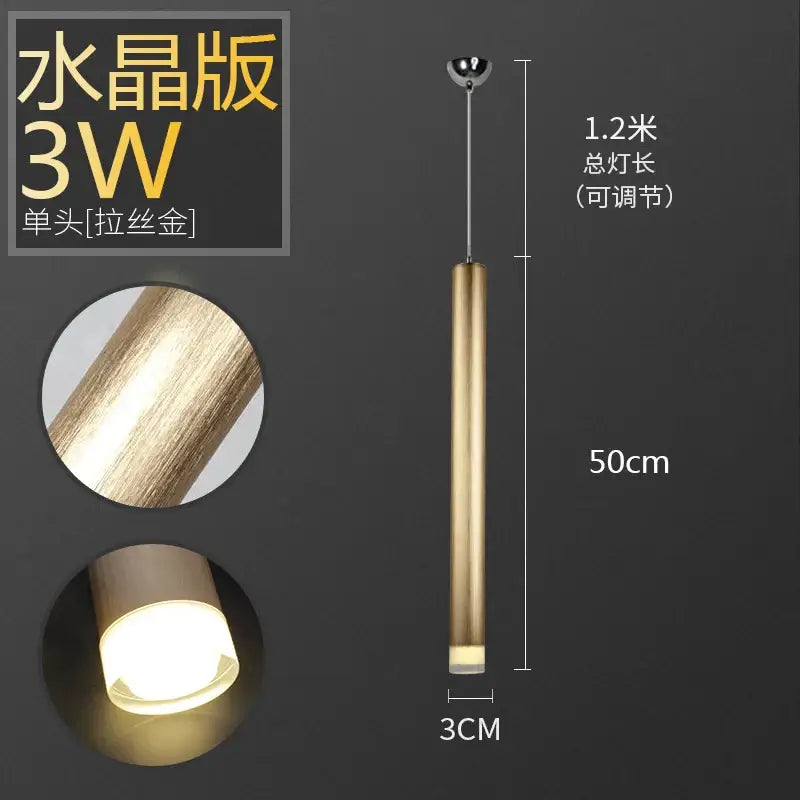 A sleek decorbites pendant light with brushed gold aluminum tube and frosted glass diffuser for dining room decor