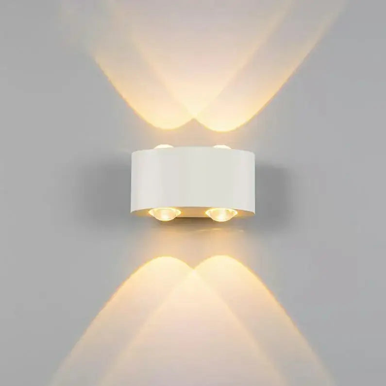 White cylindrical decorbites aluminum wall lamps with two warm led bulbs casting heart-shaped light beams