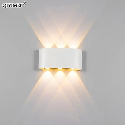 White rectangular decorbites aluminum wall lamps with three warm lights emitting soft angled glow for living room lighting