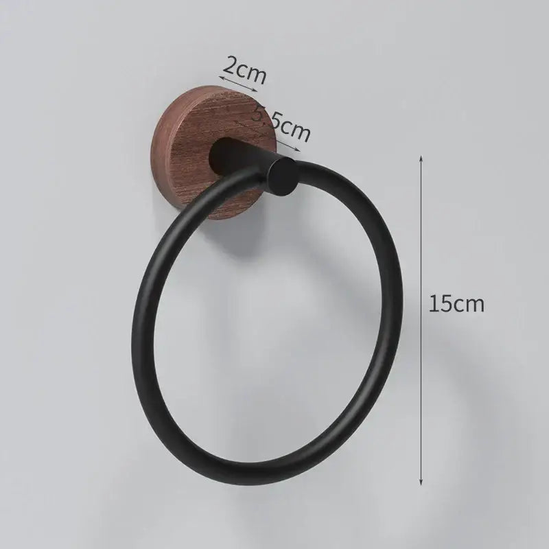 DecorBites™ black matte aluminum towel ring with circular design mounted on round walnut wood base for bathroom use