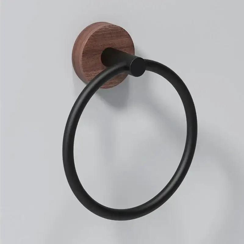 Decorbites aluminum and walnut towel ring with black matte finish and circular design mounted on round wooden base