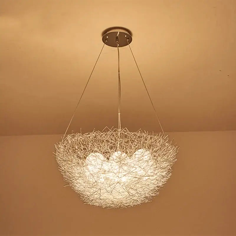 DecorBites aluminum wire bird’s nest pendant lights feature a warm glowing spherical woven design for bedrooms and restaurants