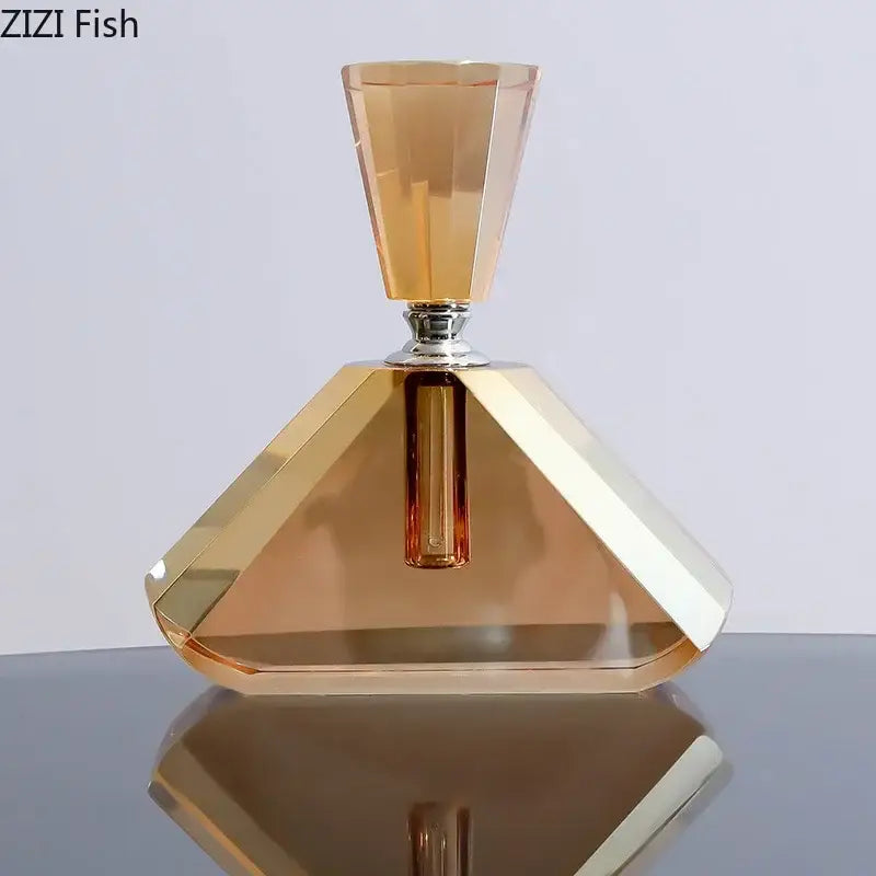 Decorbites™ amber crystal perfume bottle with geometric facets and metallic silver cap for aromatherapy use
