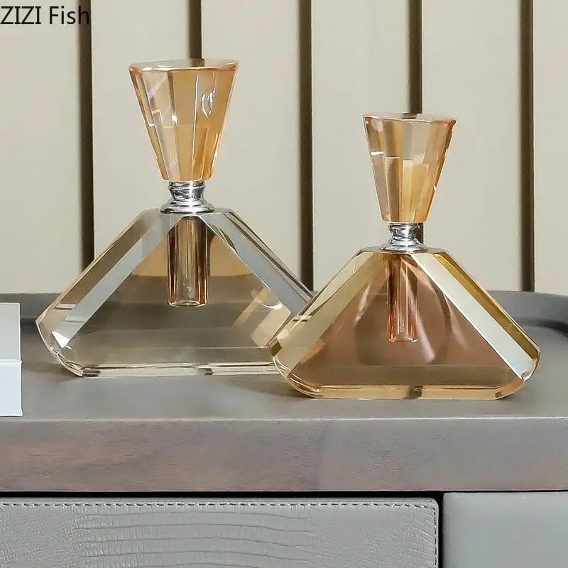 Two elegant amber crystal perfume bottles with faceted geometric design and silver-toned necks for aromatherapy use