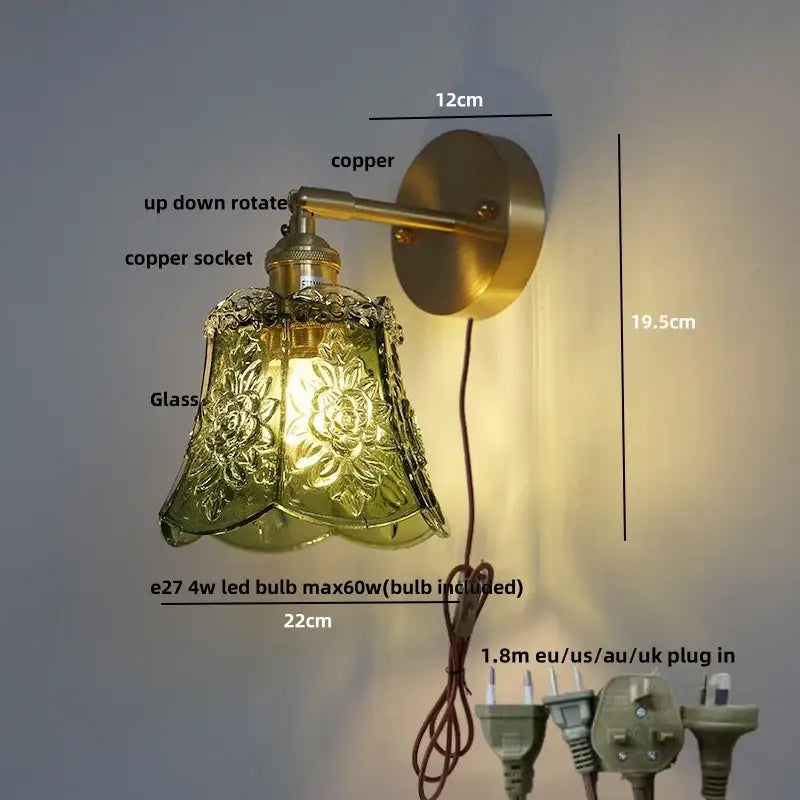 Vintage-style brass wall light with ornate green-tinted amber flower glass led shade for kitchen or bar use