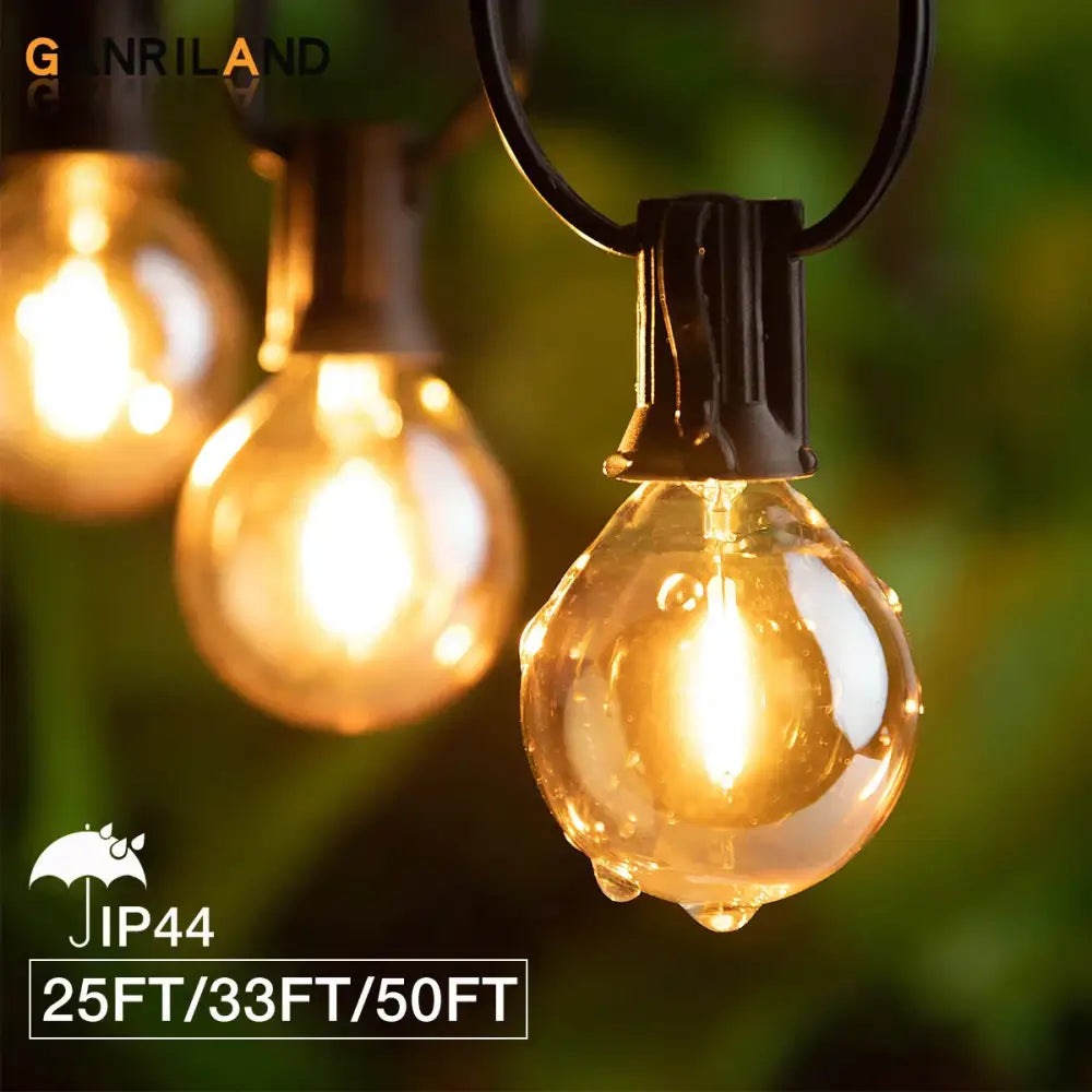 Warm-toned amber glass bulb string lights with black metal fixtures and hanging chain design for party decor