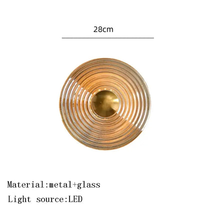 Decorbites amber glass ceiling chandelier with brass-colored concentric rings and clear glass featuring led bulb center