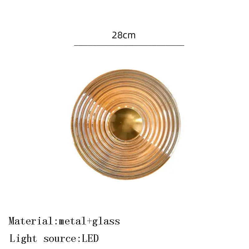 Decorbites amber glass ceiling chandelier with brass-colored concentric rings and clear glass featuring led bulb center