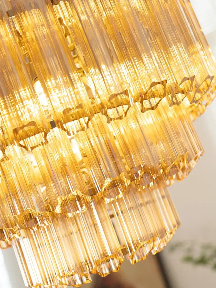 Golden DecorBites™ amber glass ceiling chandelier with tiered cascading glass rods and intricate metal accents