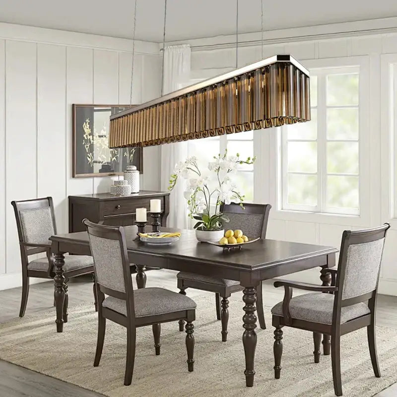 DecorBites amber glass ceiling chandelier with amber-tinted glass tubes and metallic frame above dining table