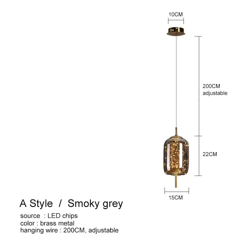 A sleek smoky grey pendant light with brass frame and embedded led chips complementing amber glass chandelier decor
