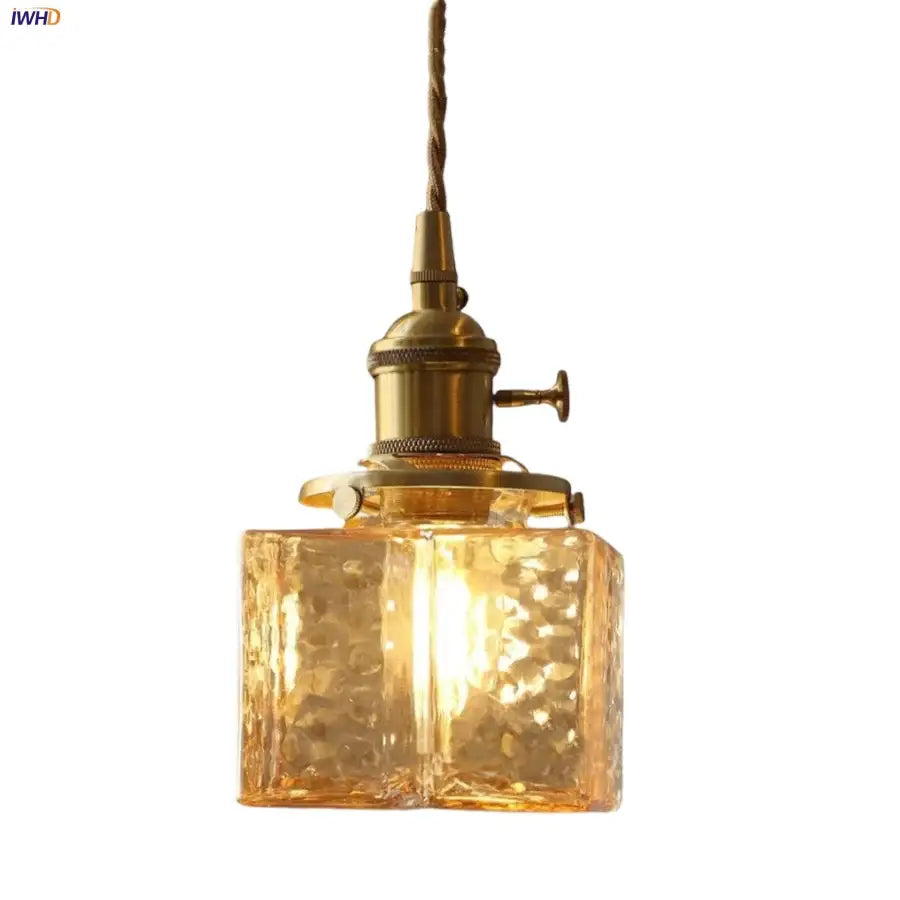 Gold-toned vintage-style led pendant light with textured amber glass shade and brass hardware for kitchen and bedroom use