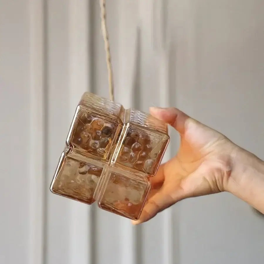 Translucent amber glass cube led pendant light with textured hammered finish and four compartments for kitchen or bedroom