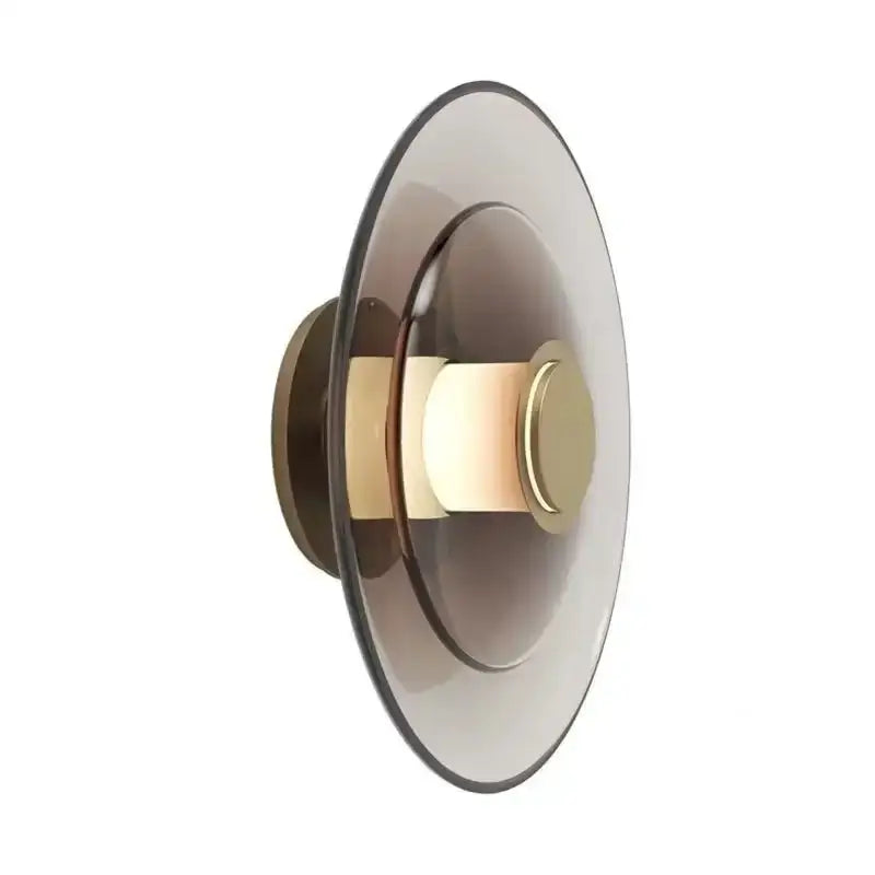 Modern wall sconce with layered smoked glass disc and brass accents from decorbites amber glass disc wall lamp collection