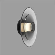 Modern black and frosted glass disc wall sconce with concentric circular design for minimalist wall lamp lighting