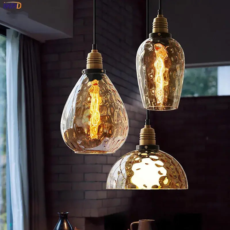 Three amber glass industrial pendant lights with brass fixtures for dining and bedroom vintage edison style