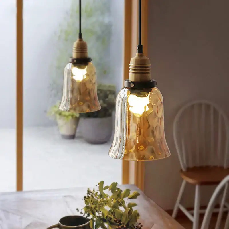 Decorbites amber glass industrial pendant lights with textured golden glass and brass fixtures for dining and bedroom use