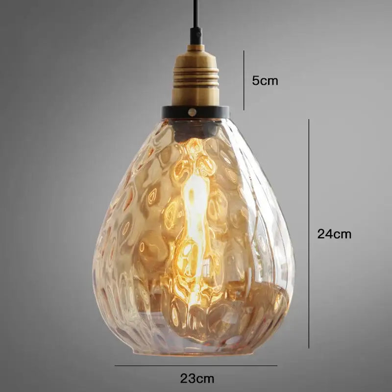 Decorbites amber glass industrial pendant lights featuring warm amber textured glass and brass bulb holder for vintage style