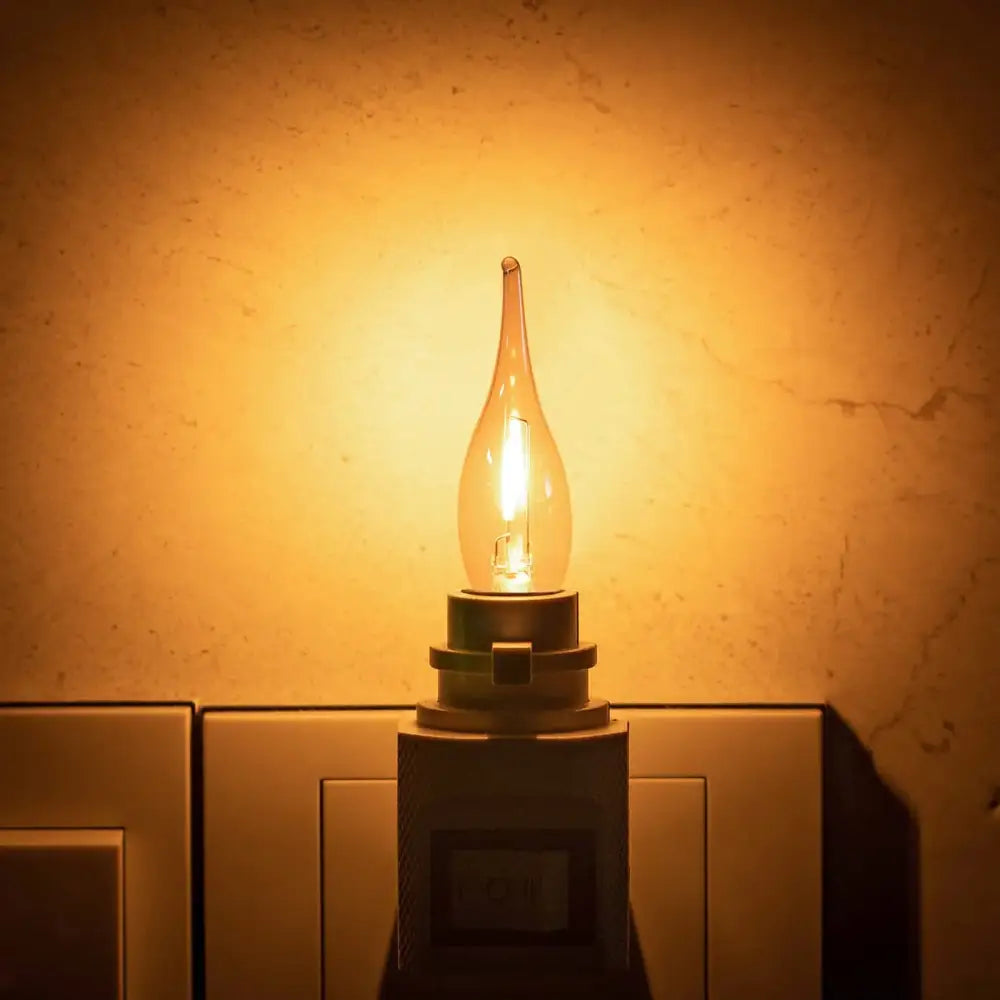 Decorbites amber glass led candle light bulb with warm amber glass envelope and brass-colored candelabra base