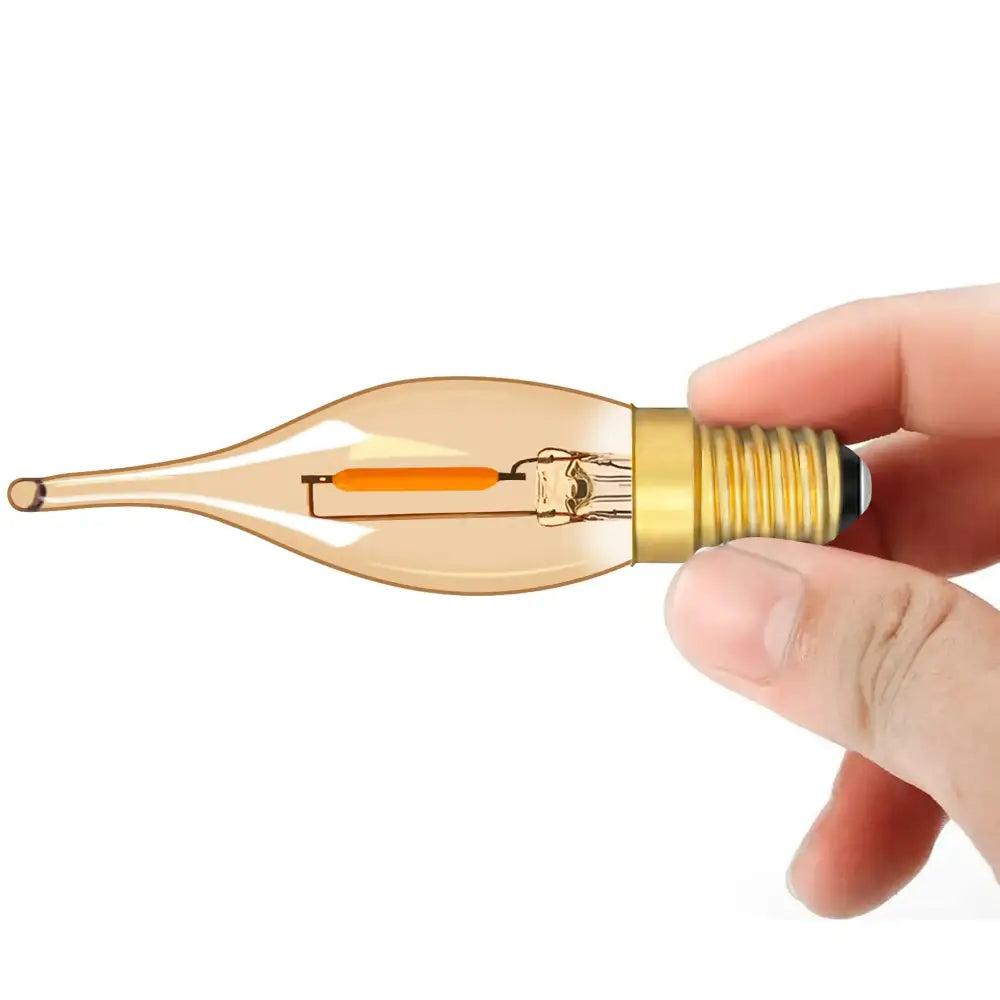 A hand holds a vintage-style DecorBites amber glass led candle bulb with brass screw base for night decor