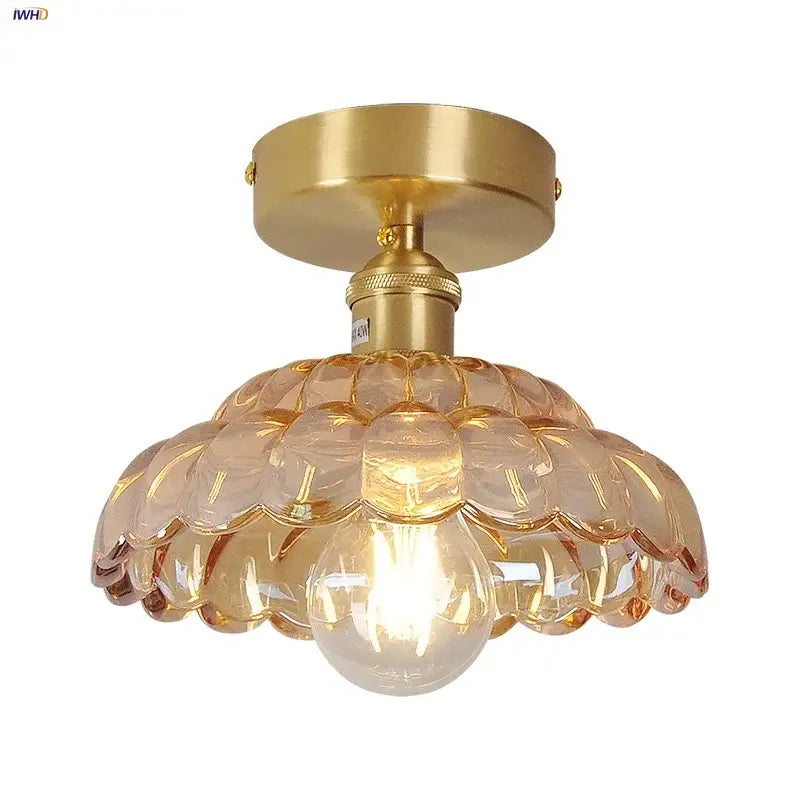 Gold-toned decorbites amber glass led ceiling lamp with scalloped amber-tinted shade and exposed bulb for indoor use
