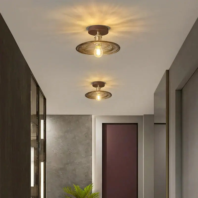 Two vintage-style decorbites amber glass led ceiling lights with warm bulbs and dark bronze metal shades for kitchen balcony