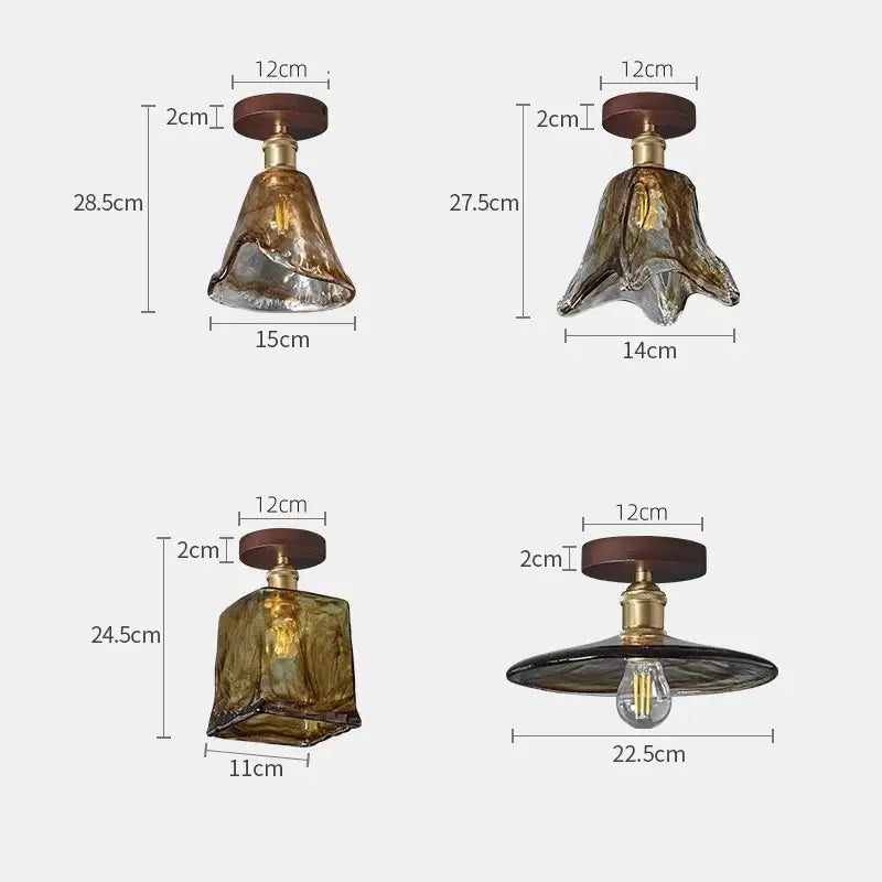 Four distinct amber glass led ceiling lights with wooden and brass accents in modern decorbites kitchen lamp design
