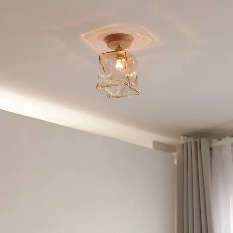 A warm-toned amber glass led ceiling light with brass finish by decorbites for home porch and restaurant decor